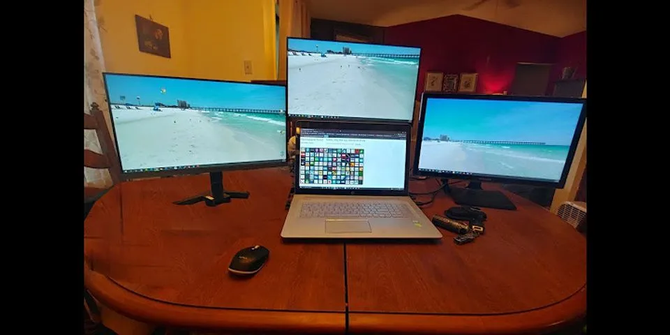 How do you connect a monitor to a laptop and use both screens?